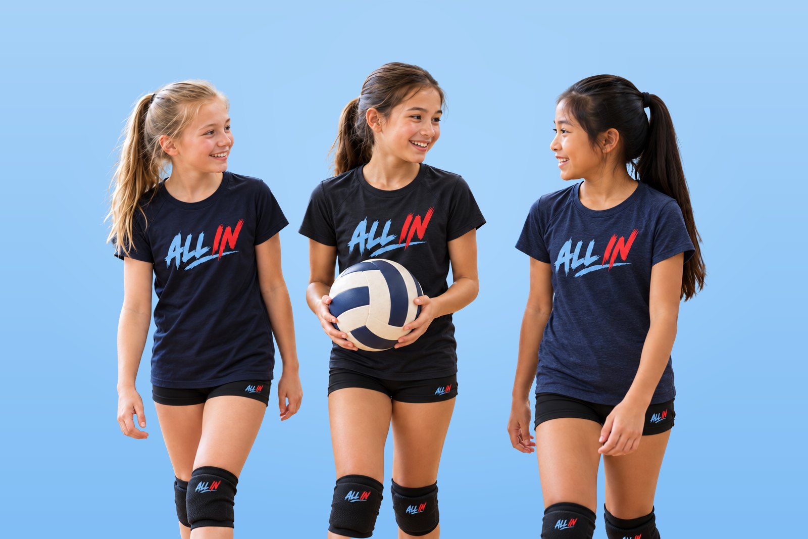 Three smiling young volleyball players in ALL IN shirts and knee pads walk together, one holding a volleyball